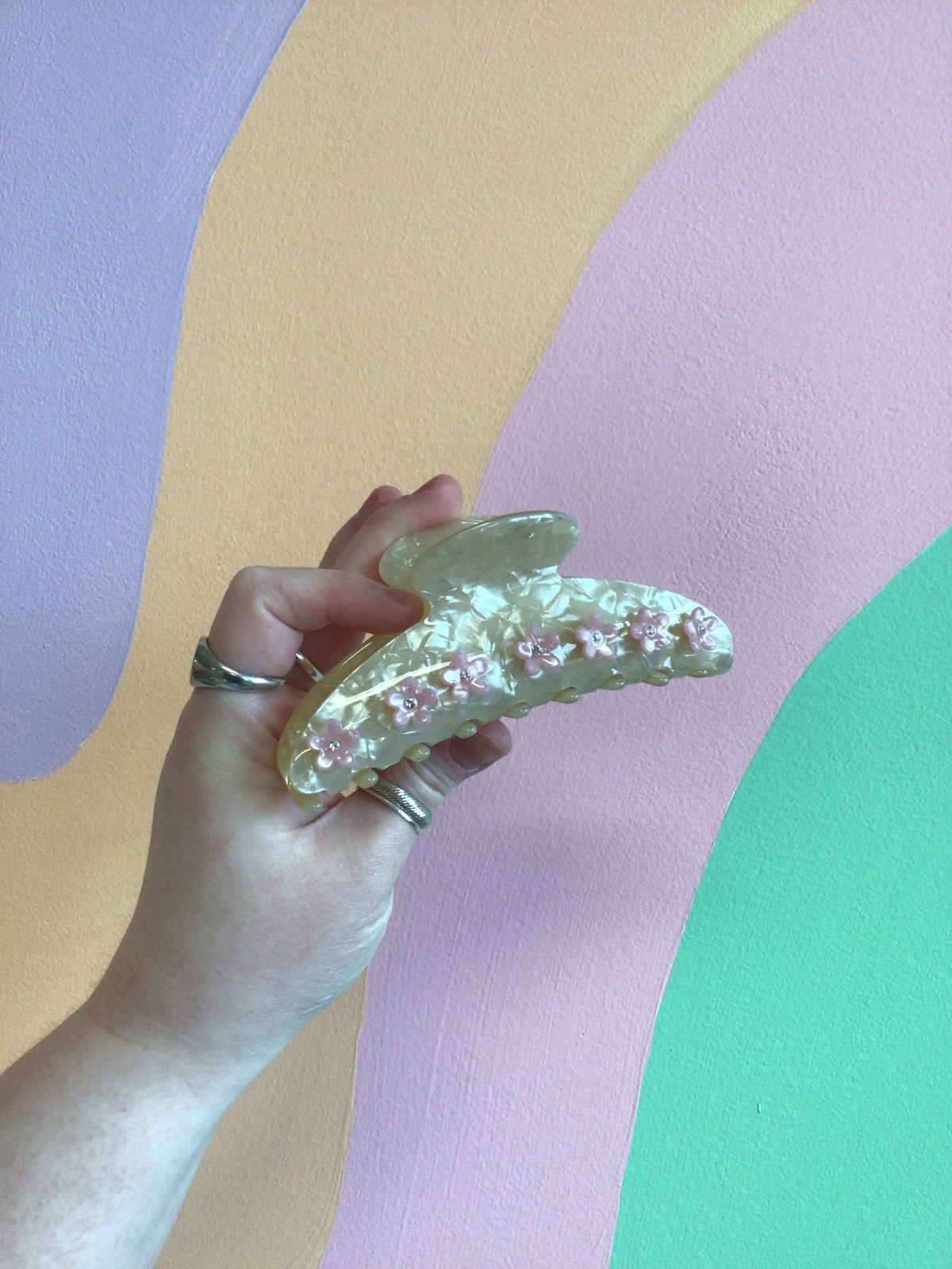 Flower hair claw clip with iridescent finish and small appliqué flowers