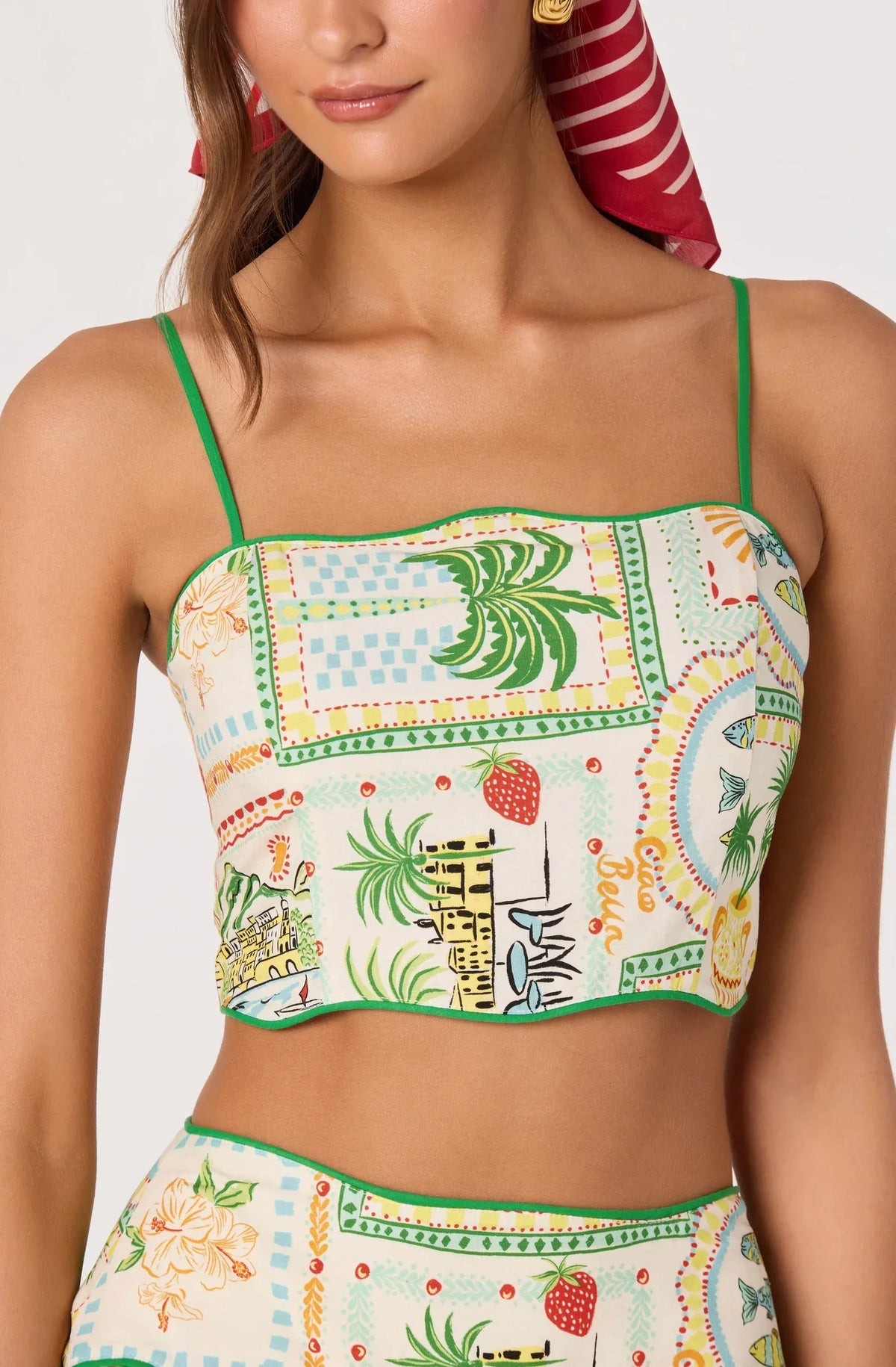 Farm print cropped camisole top with green trim, thin straps, and square neckline detail