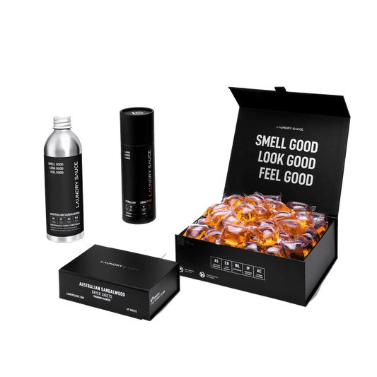Scent package set with bottle, slim spray, and open gift box of amber wax melts