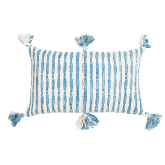 Faded indigo striped pillow with blue tassels on corners and ties