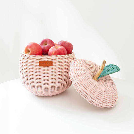 Pink woven apple storage basket shown open with apples and matching lid beside it