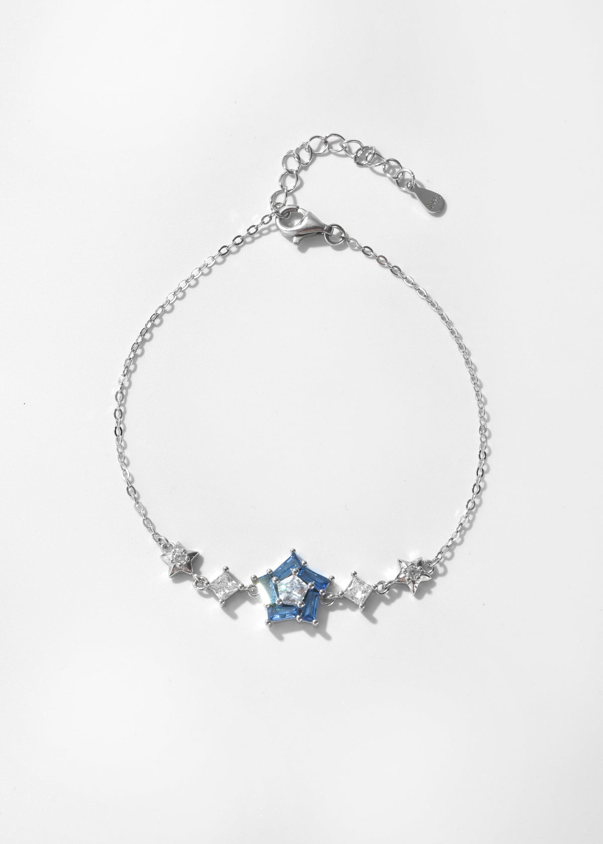 Blue crystal bracelet with a star-shaped centerpiece, clear stones, and a silver-tone chain