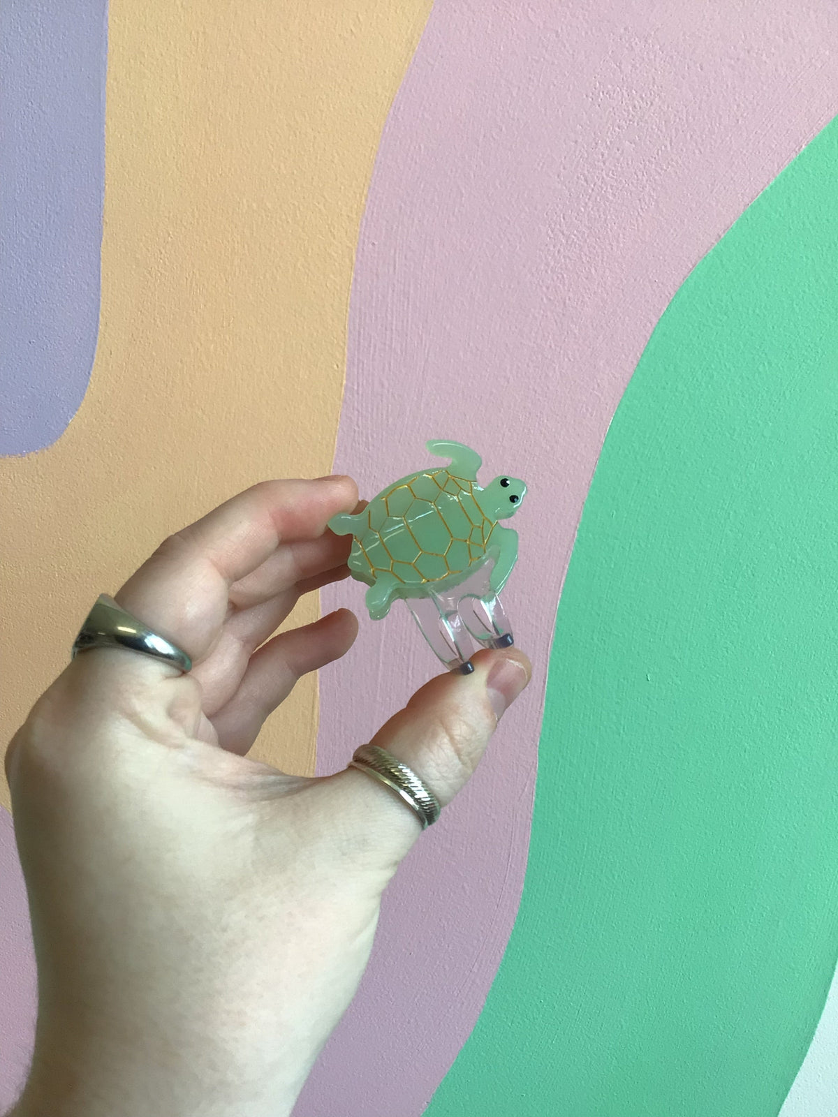 Seafoam green turtle hair claw with smooth shell and curved metal clips