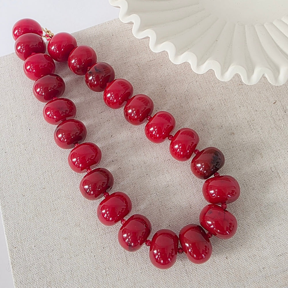 Red beaded necklace with glossy round beads