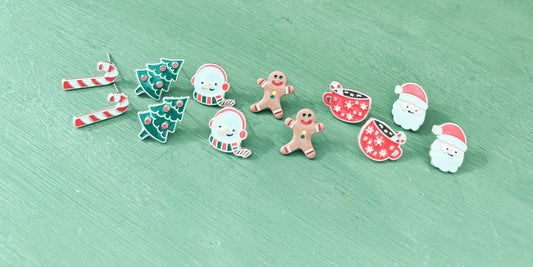 Assorted Christmas stud earrings: candy cane, gingerbread man, snowman, Santa, and tree
