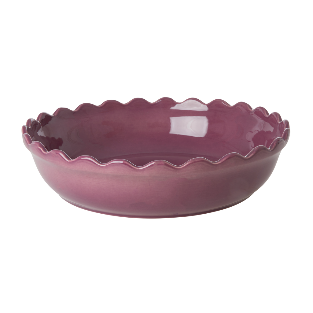 Purple round stoneware oven dish with scalloped rim