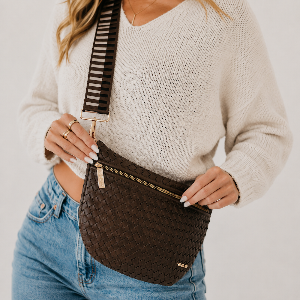 Brown woven bum bag with gold zipper, crossbody strap, and textured weave