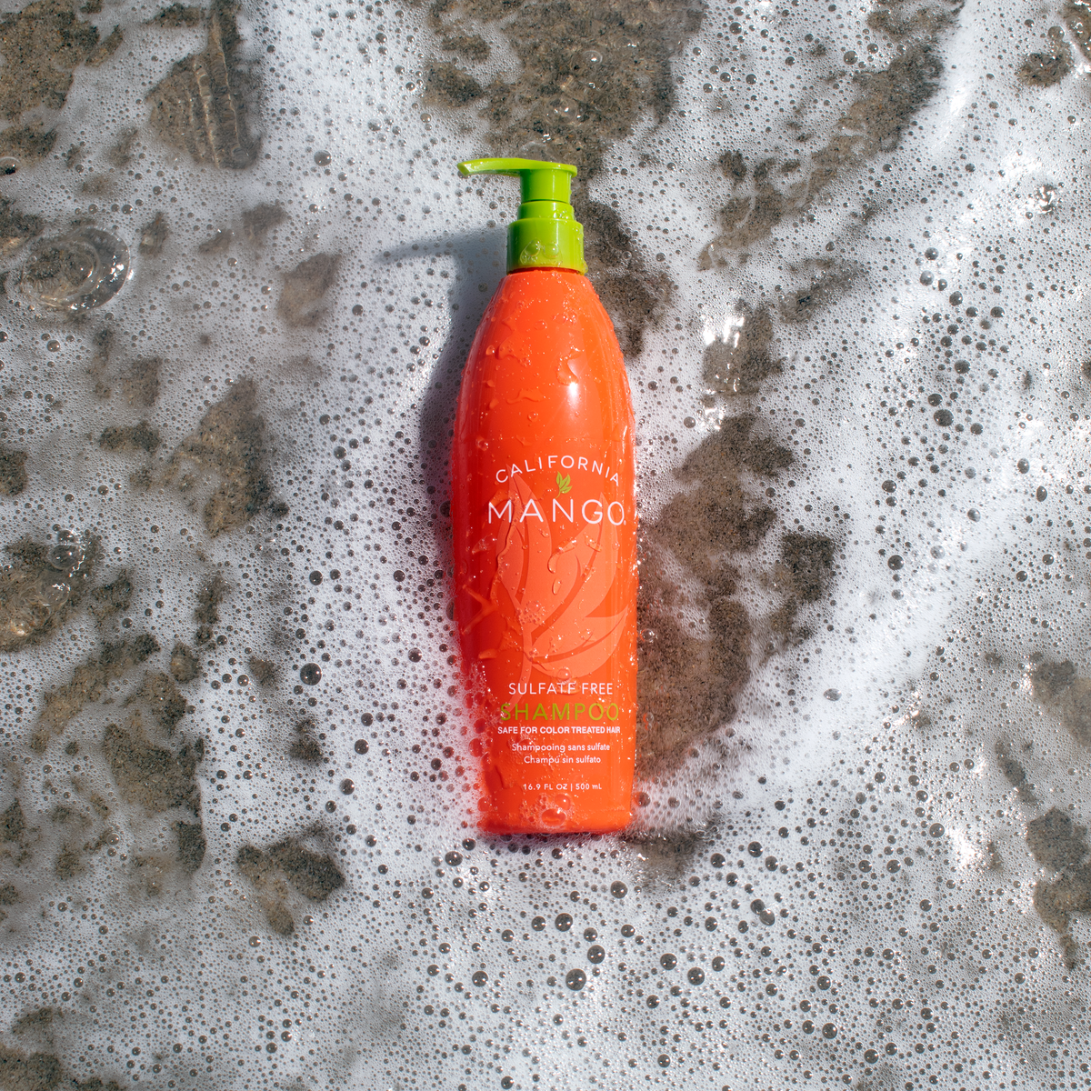 Wet California Mango sulfate-free shampoo bottle with a lime-green pump.