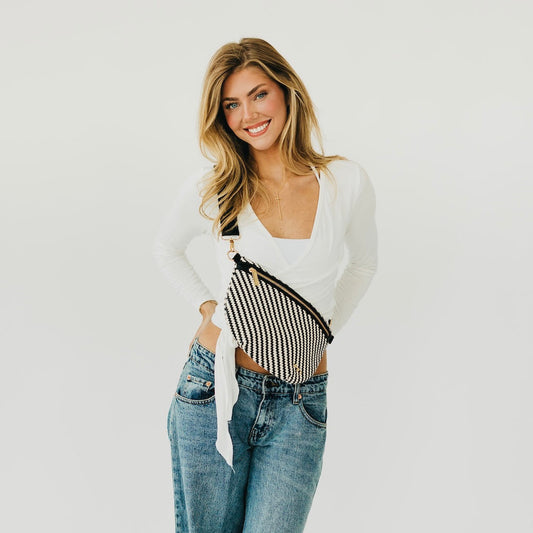 Woven bum bag with black and white diagonal stripe pattern, zip top and crossbody strap