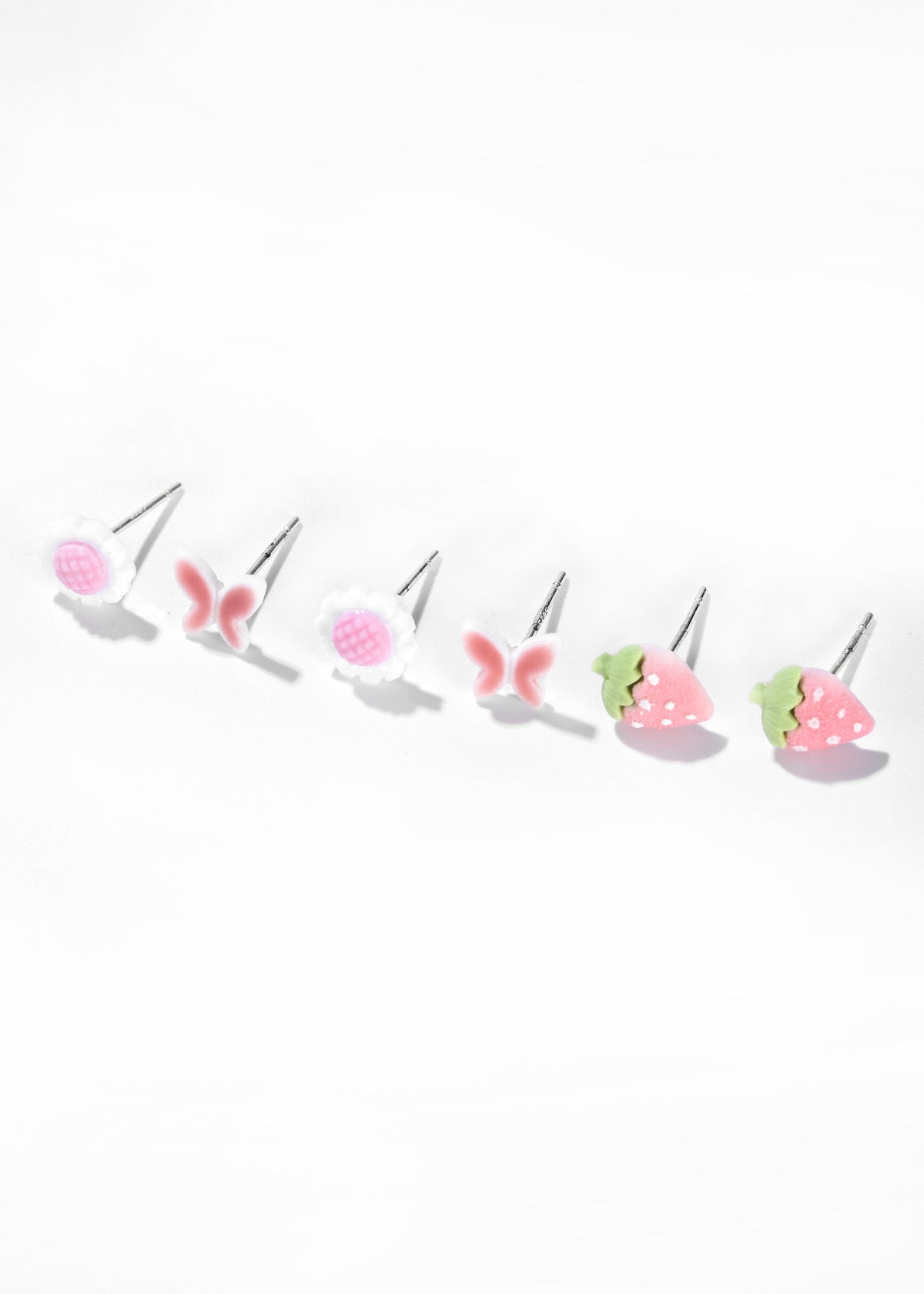 Set of six colorful fruit-shaped earrings, including strawberries, raspberries, and cherries