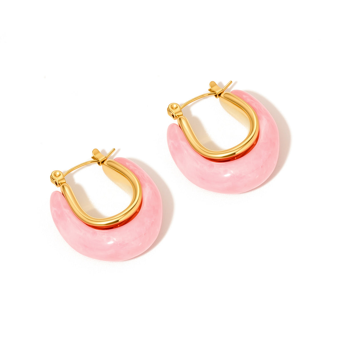 Pair of gold-tone hoop earrings with glossy pink resin teardrop accents