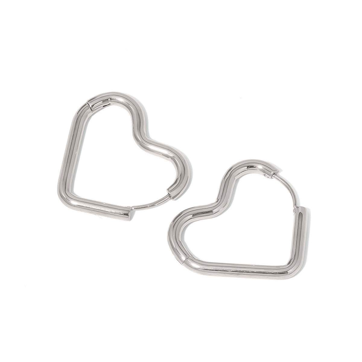 Silver-tone open heart hoop earrings, two earrings shown on a plain background.