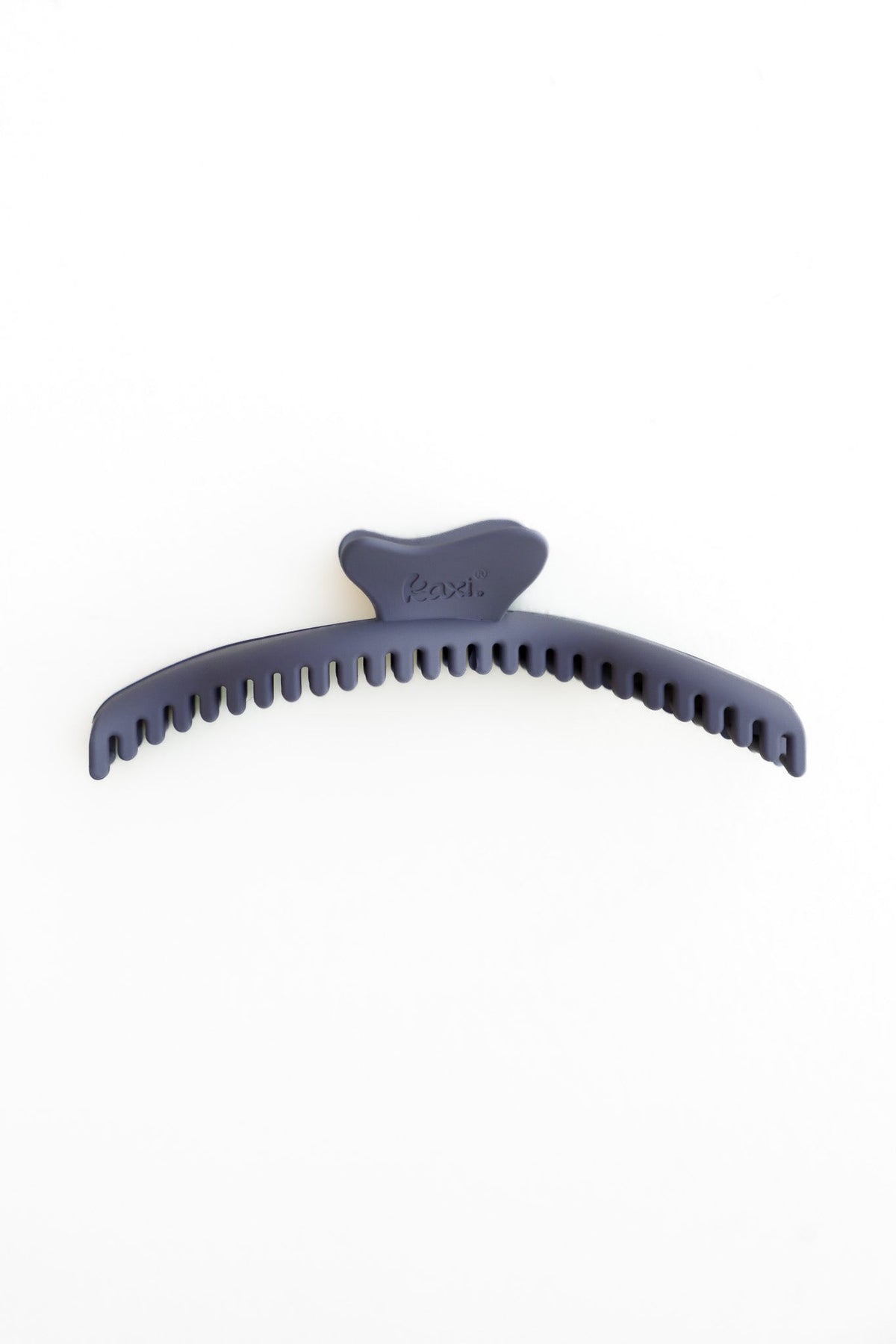 Wavy claw hair clip in dark navy blue, ridged grip arch shape