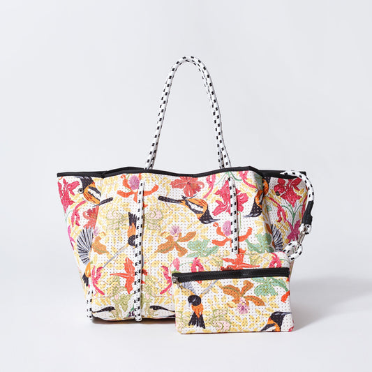 Floral tote bag with striped handles and a front zippered pouch
