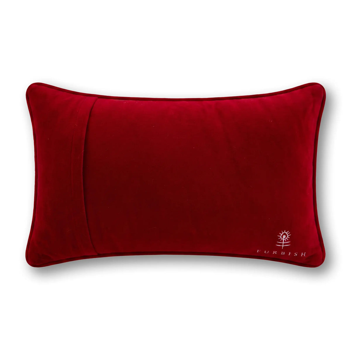 Velvet red decorative pillow with small logo embroidery at lower right