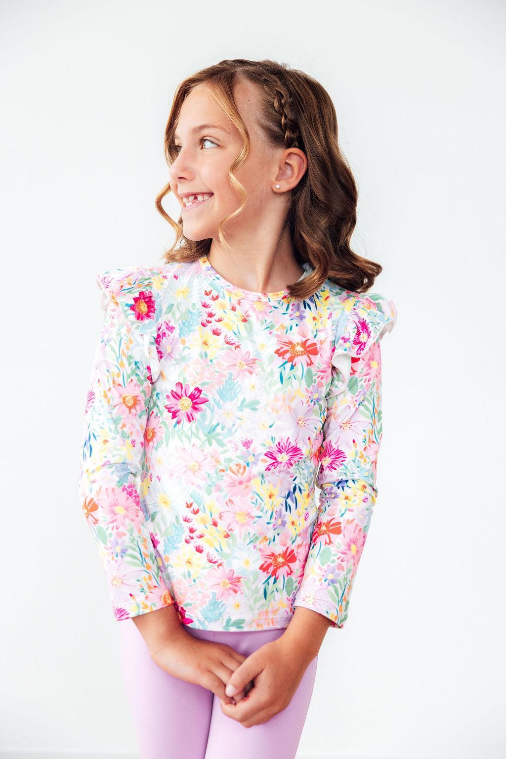 Girls long-sleeve ruffle tee with pastel floral print and puffed shoulders