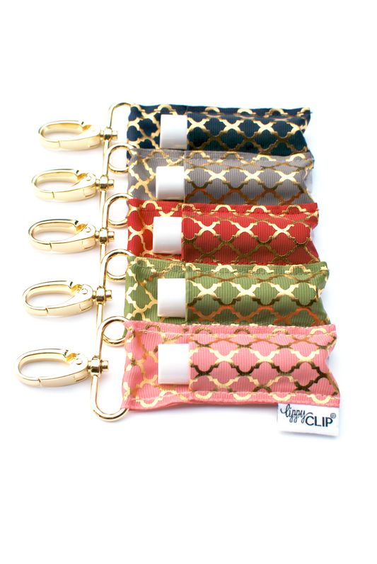 Set of quatrefoil lippy clip lip balm holders in assorted colors with keyrings