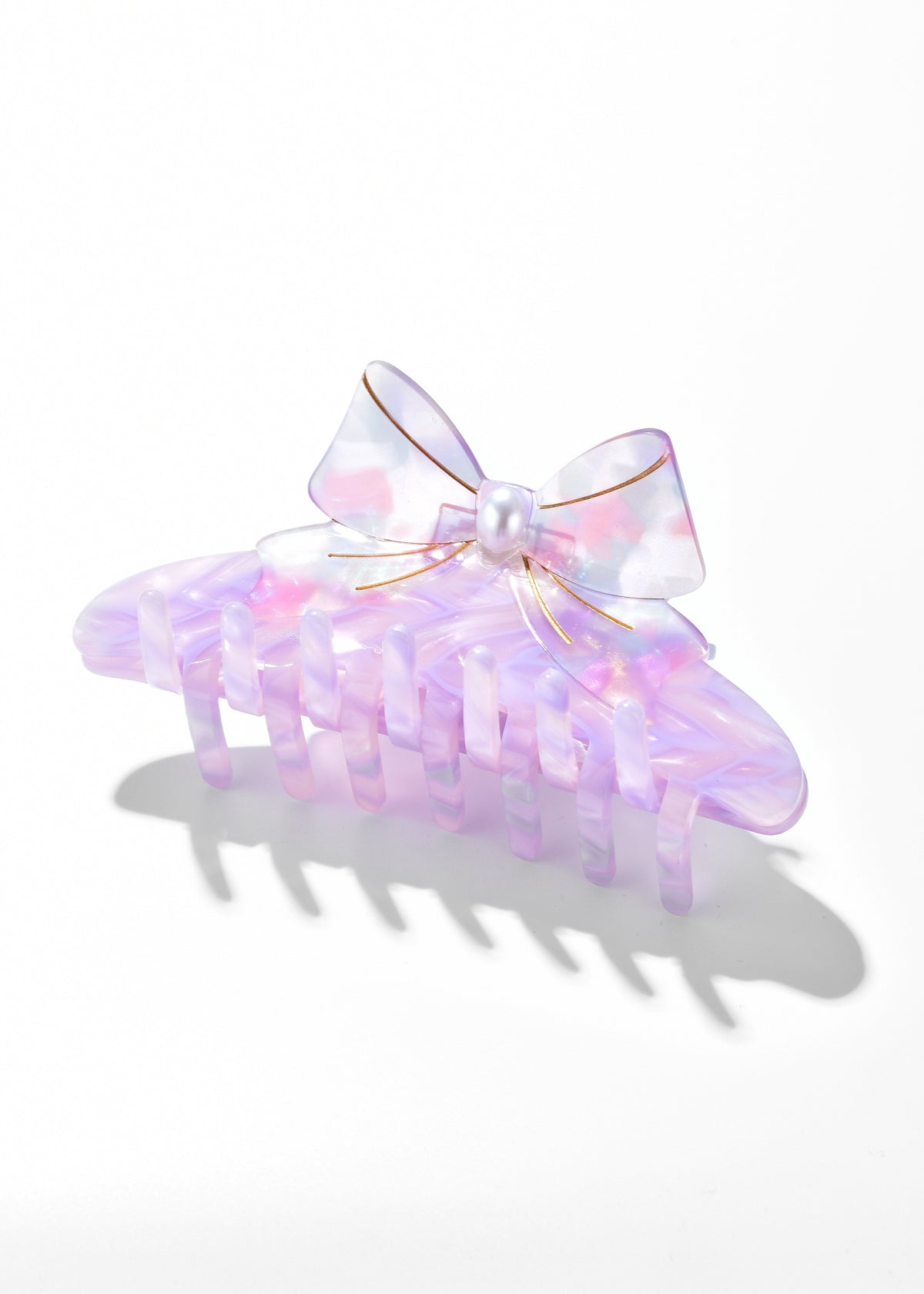 Lavender iridescent claw clip with a pale bow and pearl-like center
