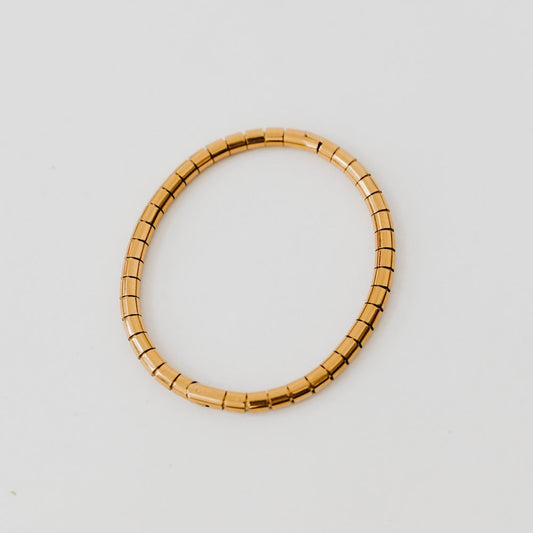 Gold hinged bangle bracelet with segmented rectangular links