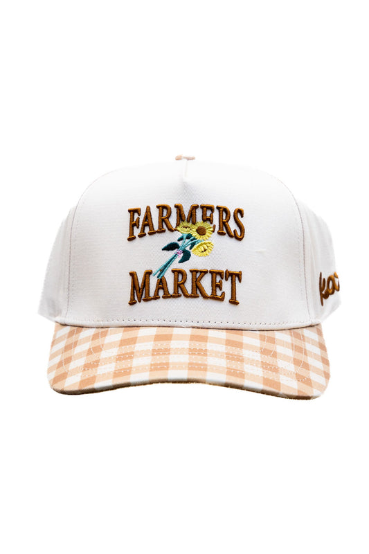 White trucker cap with embroidered Farmers Market logo and orange gingham front panel