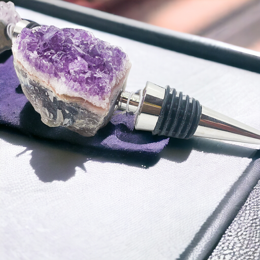 Purple amethyst wine bottle stopper with chrome metal spout and black ribbed collar