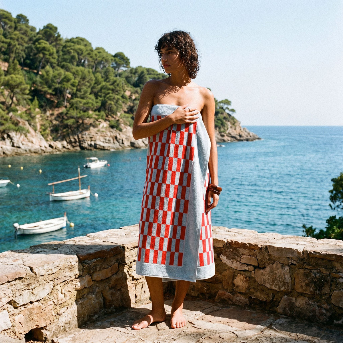 Red-and-white check cotton bath towel wrapped like a sarong