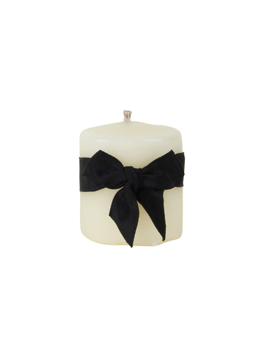 Ivory beeswax pillar candle with black bow wrap, 3-inch diameter