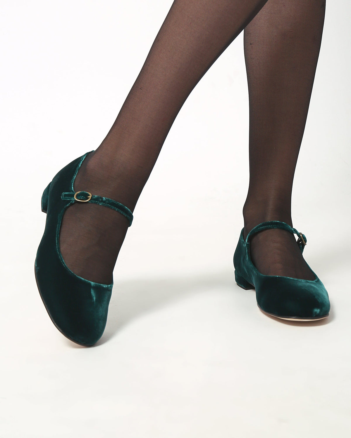 Dark teal velvet Mary Jane pumps with ankle strap and oval buckle, low heels