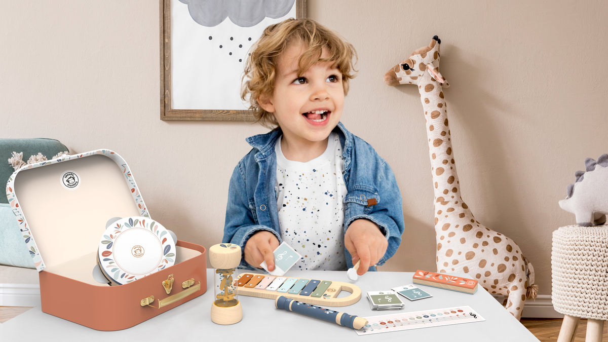 Children's musical instrument set with xylophone, tambourine, recorder and shaker arranged for play