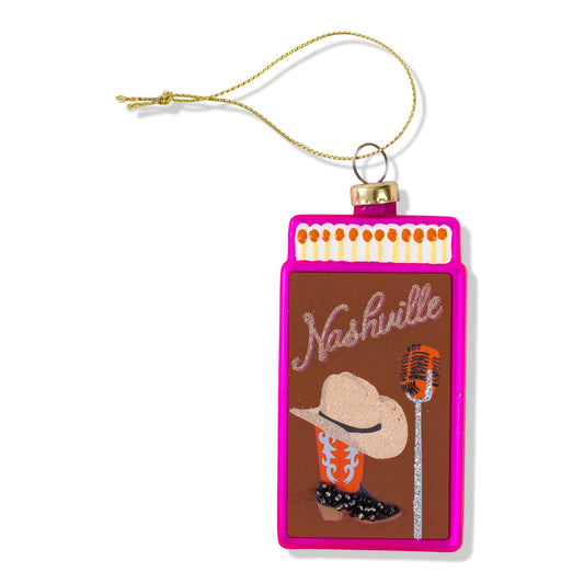 Pink matchbook ornament with a hanging loop and Nashville graphic