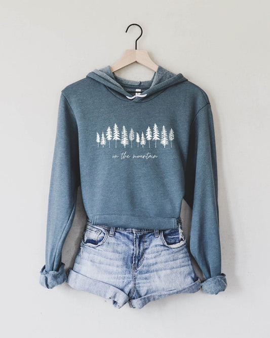 Heather blue sponge fleece hoodie with forest tree graphic, front pouch pocket, hood