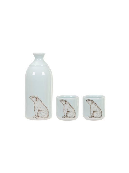 Icy white sake pitcher with polar bear design and two matching cups