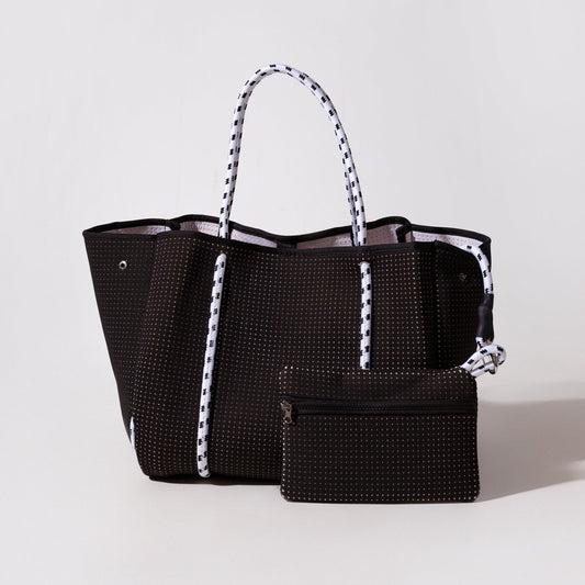 Black perforated tote with striped handles, front zipper pocket, and zip pouch.