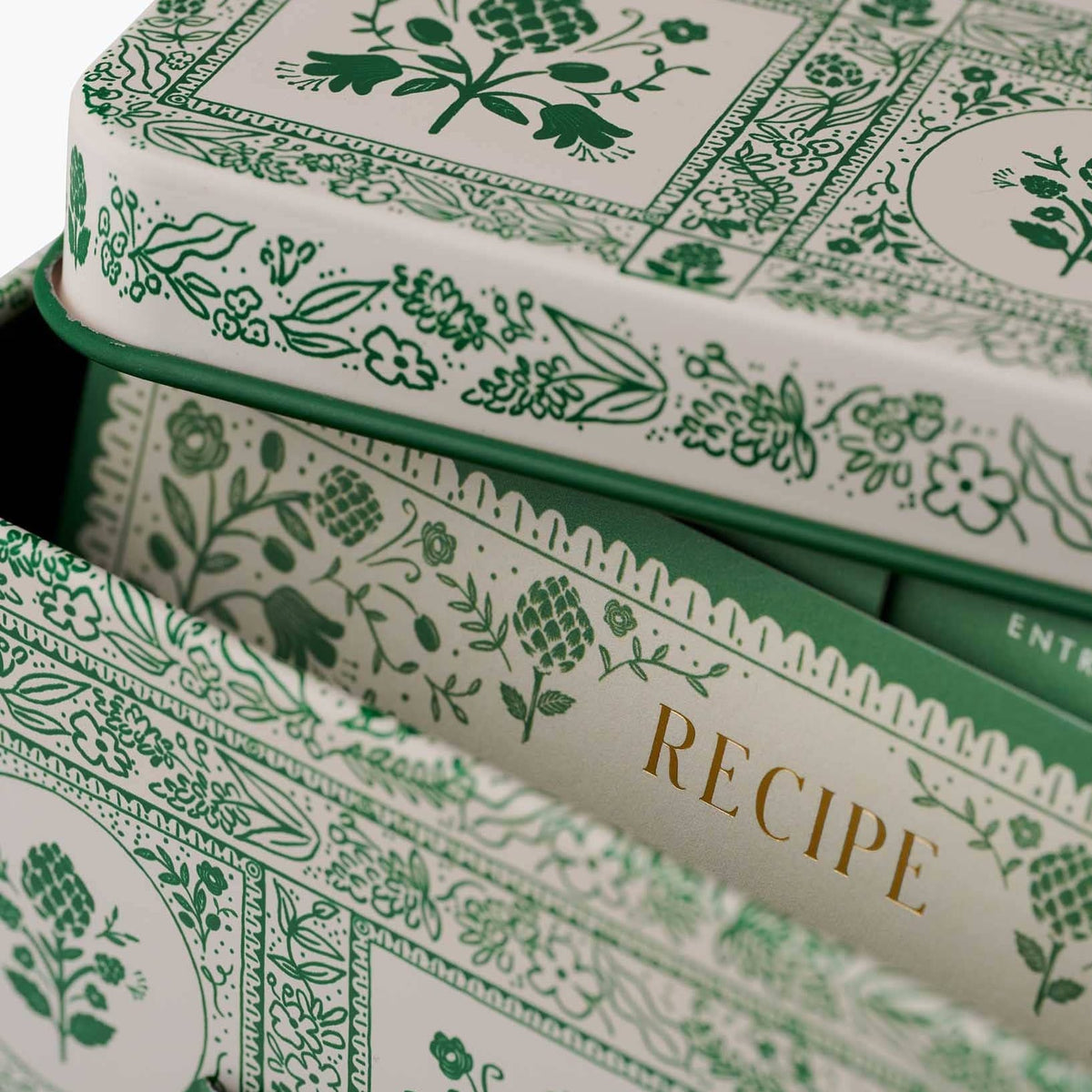 Recipe tin interior with gold 'RECIPE' text and green patterned sides