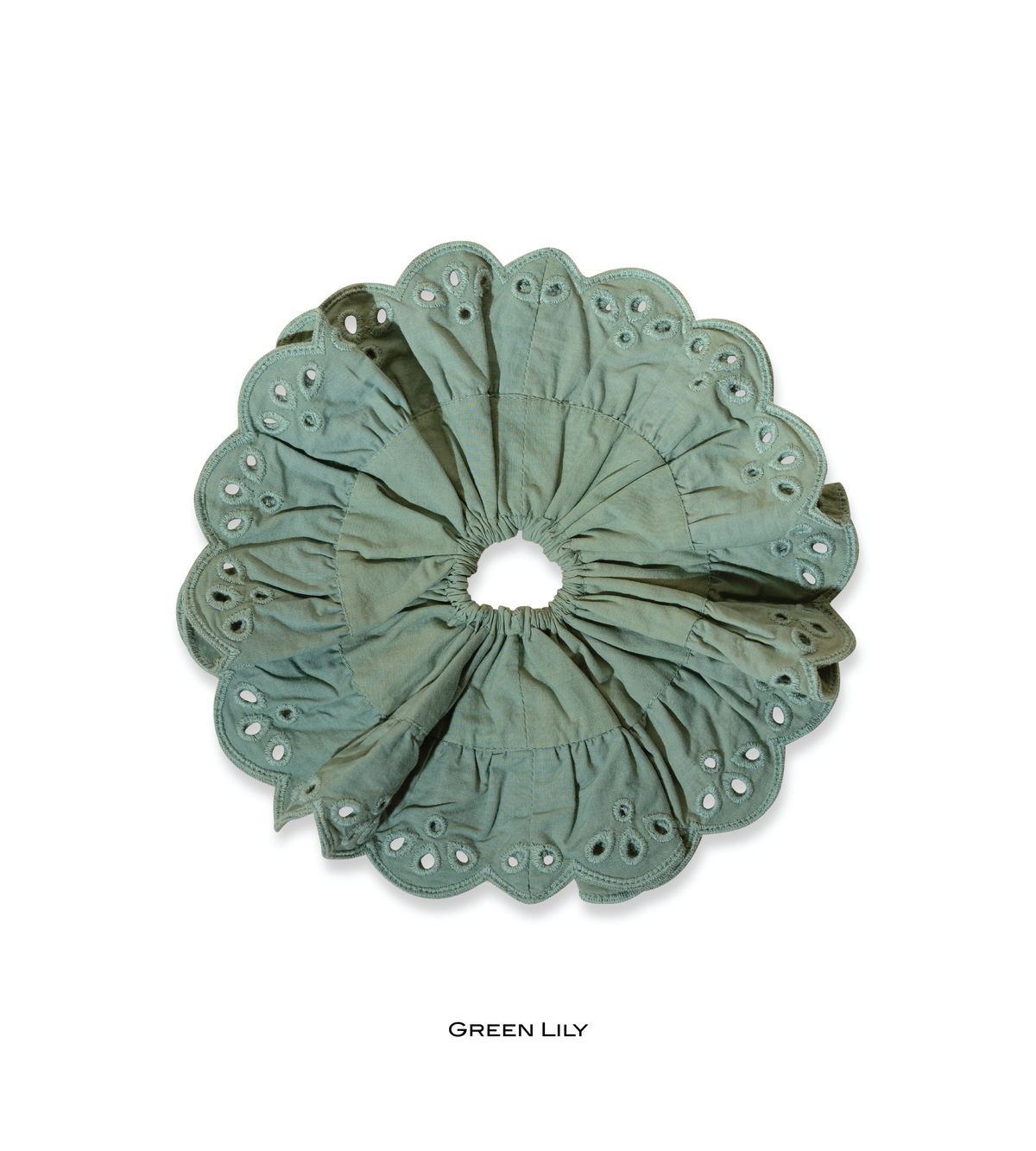 Green Lily eyelet scrunchie in muted sage green with scalloped edges.