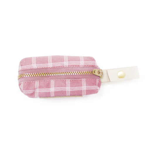 Pink plaid waste bag holder pouch with gold zipper and white snap strap tab