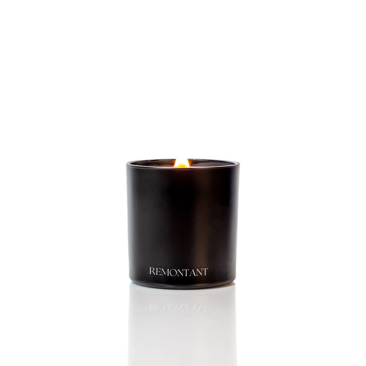Black Remontant candle with a visible flame