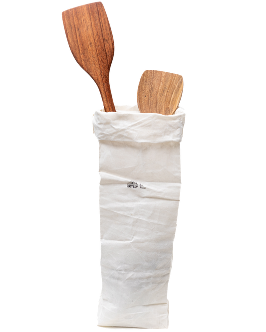 Walnut curved wooden spatulas with rounded heads and long handles.