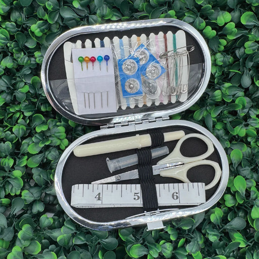 Open Simply Southern® metal sewing kit tin with pins, needles, thread and scissors