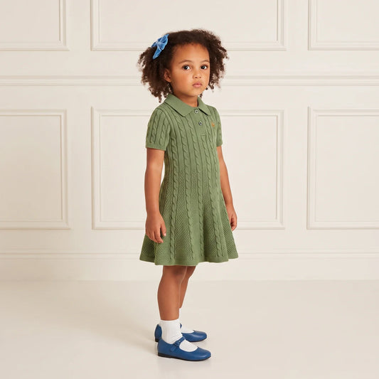 Sage green cable-knit polo dress on a child, buttoned front and short sleeves