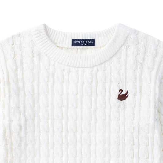 White cable knit baby sweater with crew neckline and embroidered chest logo