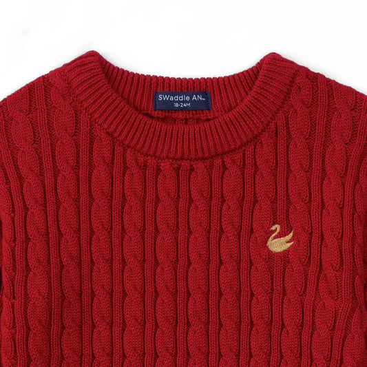 Red cable-knit baby sweater with ribbed crew neck and swan logo