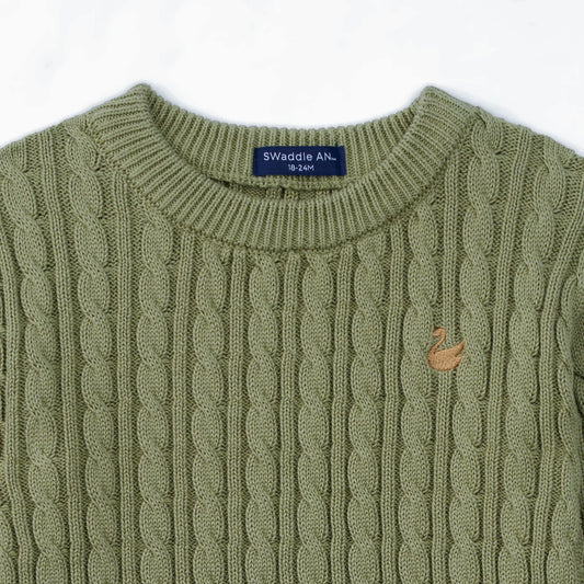 Sage green cable knit baby sweater close-up of ribbed crew neck and texture