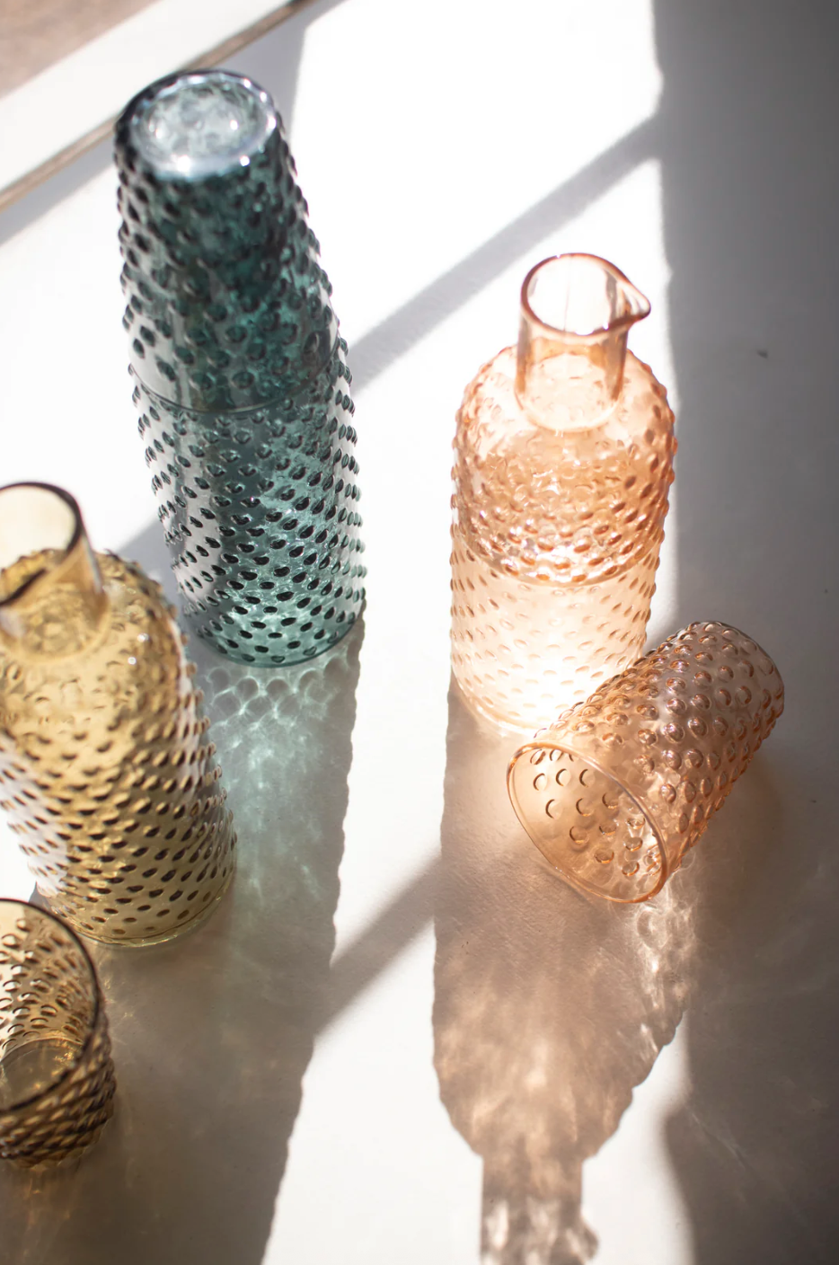 Bubble-textured glass carafe with matching tumbler, teal and peach colors