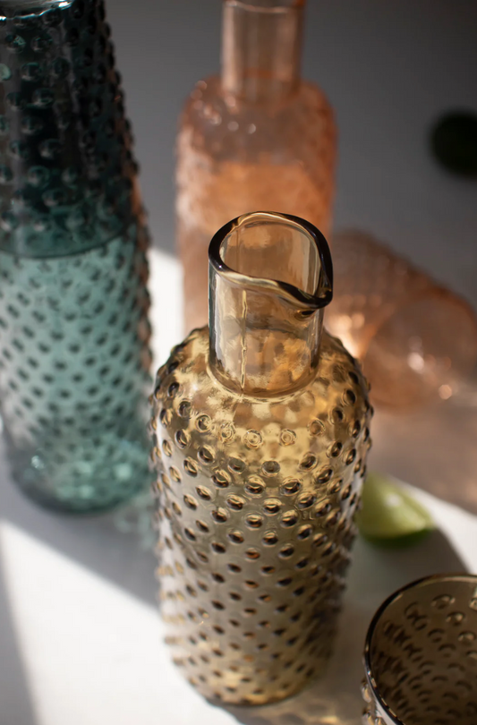 Bubble-textured amber glass carafe with loop handle, open spout