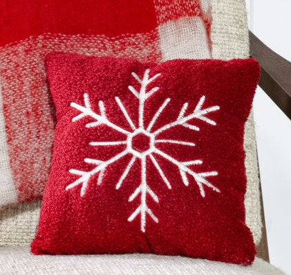 Red teddy fur pillow with a white embroidered snowflake