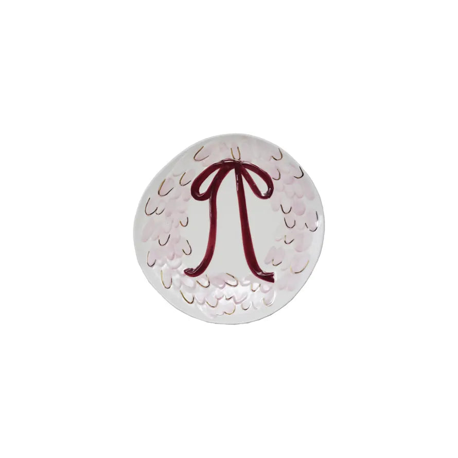 Stoneware serving platter with wreath-and-bow design, white with pink and red accents