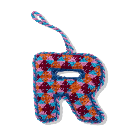 Needlepoint letter R ornament with multicolor stitched plaid pattern and hanging loop