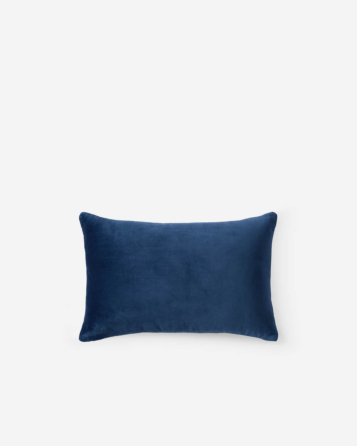 Solid navy small lumbar pillow, plain front with soft velvet texture.