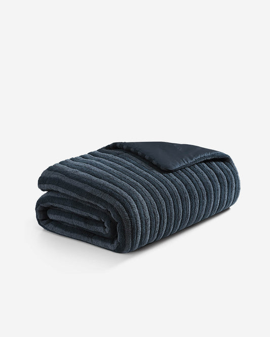 Piped comforter, dark blue quilted stripes with folded top seam